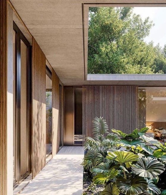 Timber and glass facade opening to planting