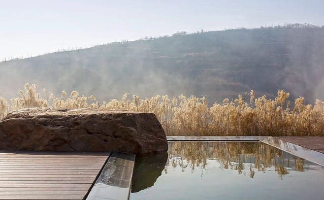 Pool terrace meeting raw rock