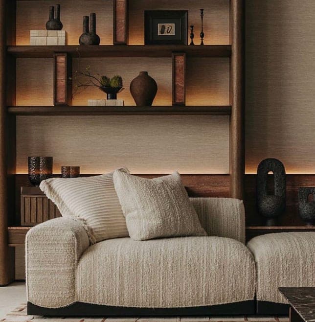 Living room with walnut joinery and bouclé seating